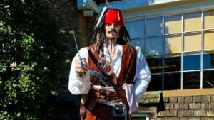 a man dressed as a pirate holding a gun